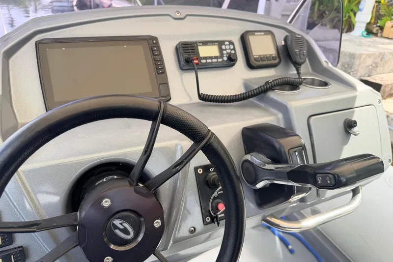 Slide: The Image of Steering console of 2020 Grand Inflatables G580 boat with navigation equipment and controls. - 27