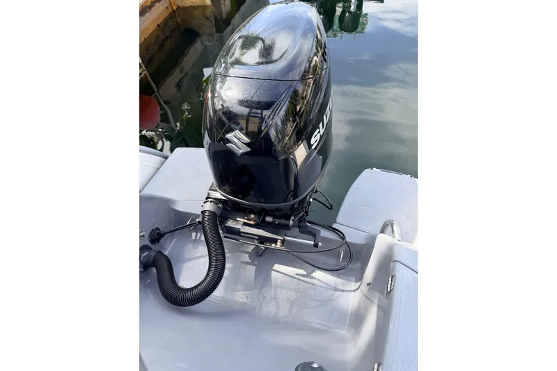 Slide: The Image of 2020 Grand Inflatables G580 boat with Suzuki outboard motor on calm water. - 33