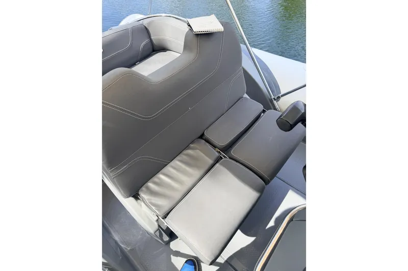 Slide: The Image of 2020 Grand Inflatables G580 boat seat with sleek gray upholstery and armrest. - 35