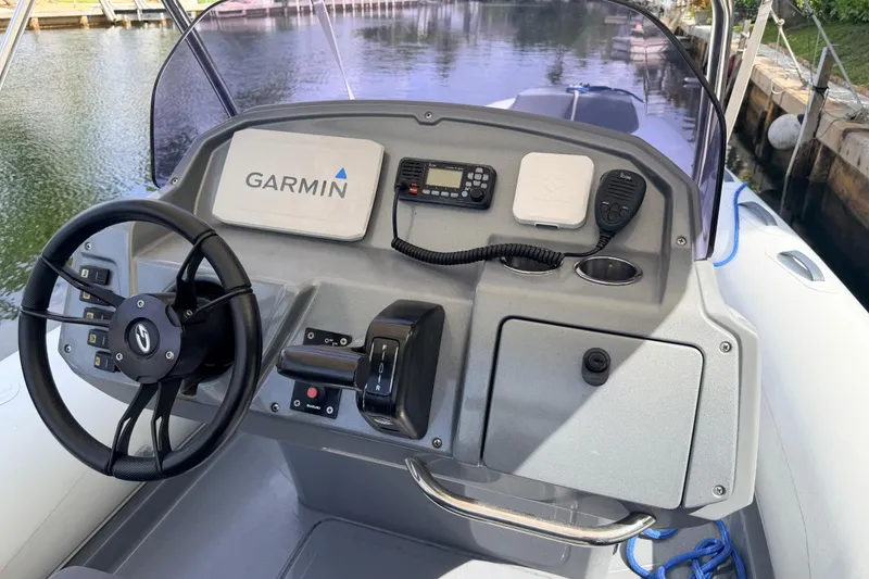 Slide: The Image of Steering console of 2020 Grand Inflatables G580 with Garmin navigation system. - 40