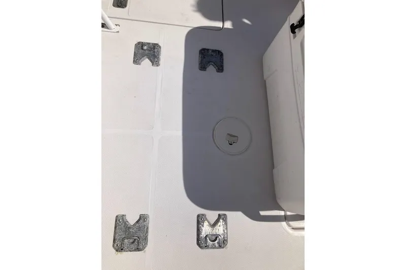 Slide: The Image of Deck of 2005 Donzi 35 ZF Daytona boat with metal fixtures and hatch. - 46