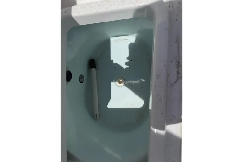 Slide: The Image of Livewell interior of 2015 Sportsman Heritage 231 Center Console boat. - 11