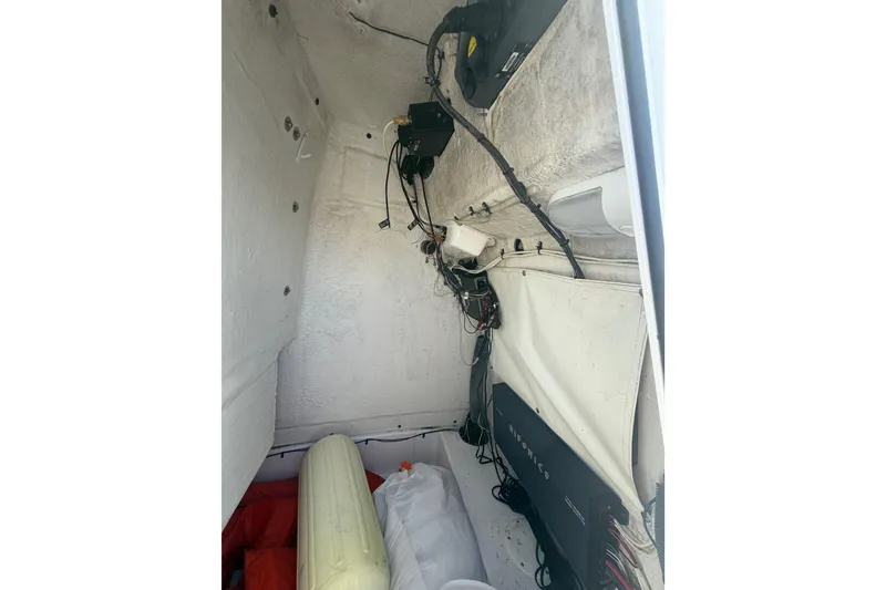 Slide: The Image of Interior view of a 2015 Sportsman Heritage 231 Center Console boat's storage compartment. - 12