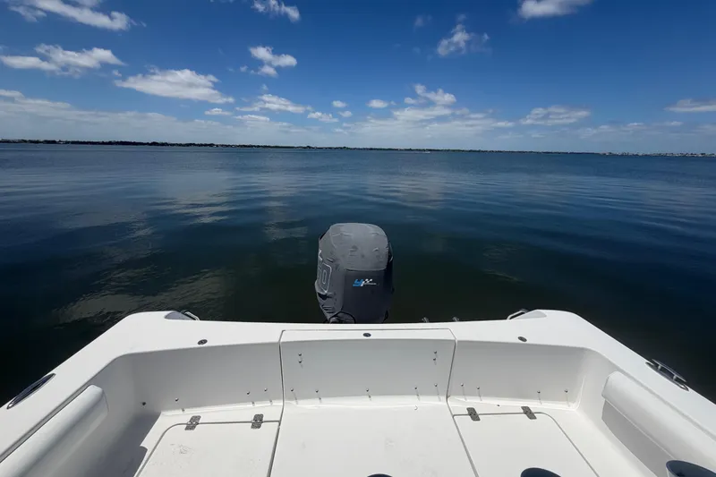 Slide: The Image of 2015 Sportsman Heritage 231 Center Console on calm water under blue sky. - 4