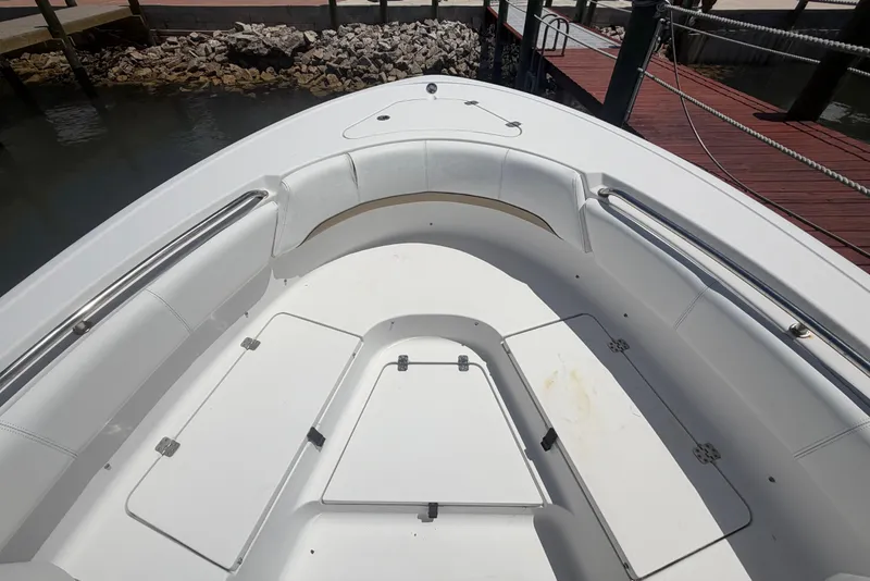 Slide: The Image of 2015 Sportsman Heritage 231 Center Console boat interior with seating and storage compartments. - 5