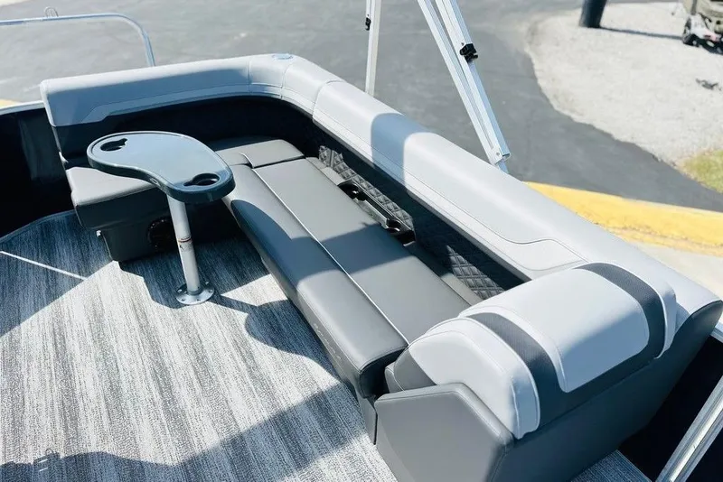 Slide: The Image of 2026 Bennington S L-Bench 20 SL TRITOON interior with sleek seating and table. - 4