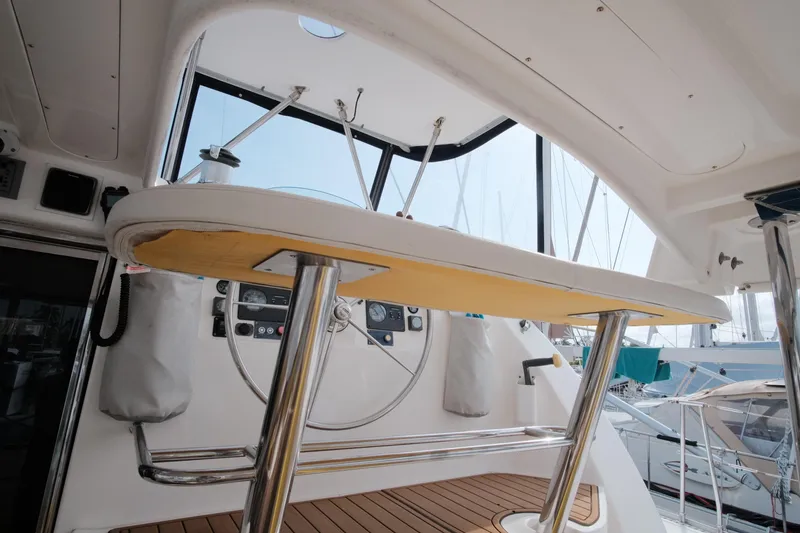Slide: The Image of Interior view of a 2007 Leopard 46 yacht cockpit with steering wheel and controls. - 13