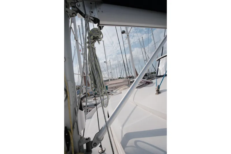 Slide: The Image of Sailboat deck view with rigging, Leopard 46 model, 2007, in a marina setting. - 21