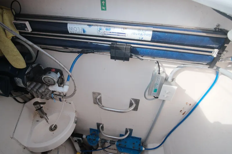 Slide: The Image of Interior of a 2007 Leopard 46 yacht showing water filtration system and plumbing. - 24