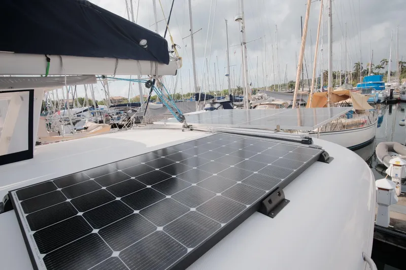 Slide: The Image of Solar panels on a 2007 Leopard 46 yacht in a marina setting. - 27