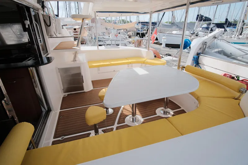 Slide: The Image of Luxurious 2007 Leopard 46 yacht interior with yellow seating and modern design. - 28