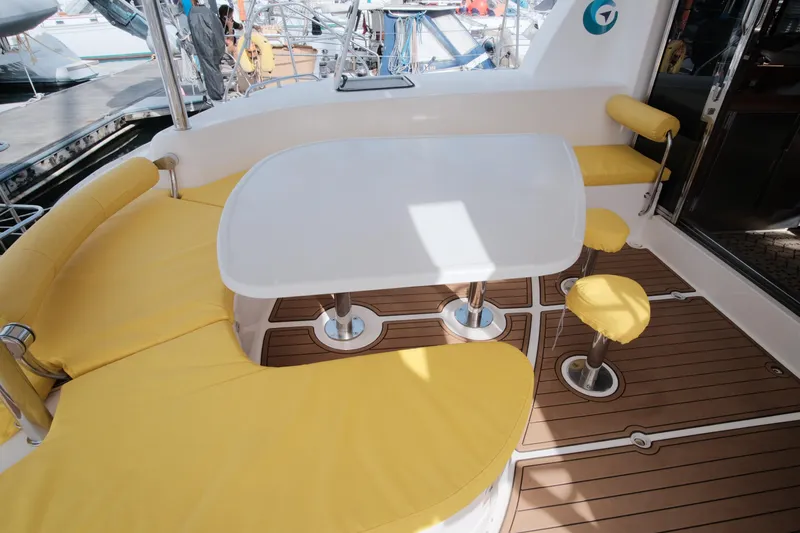 Slide: The Image of Leopard 46 yacht interior with yellow seating and wooden flooring, 2007 model. - 29