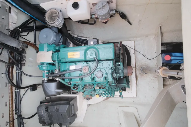 Slide: The Image of Engine compartment of a 2007 Leopard 46 yacht, showcasing mechanical components and wiring. - 33