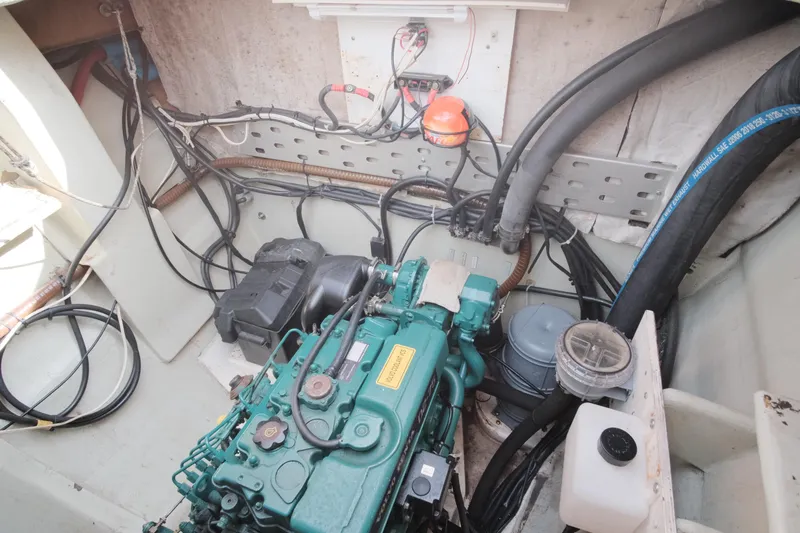 Slide: The Image of Engine compartment of a 2007 Leopard 46 yacht, showcasing wiring and mechanical components. - 34