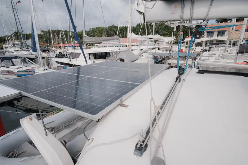 Slide: The Image of Solar panels on a 2007 Leopard 46 yacht docked at a marina. - 38