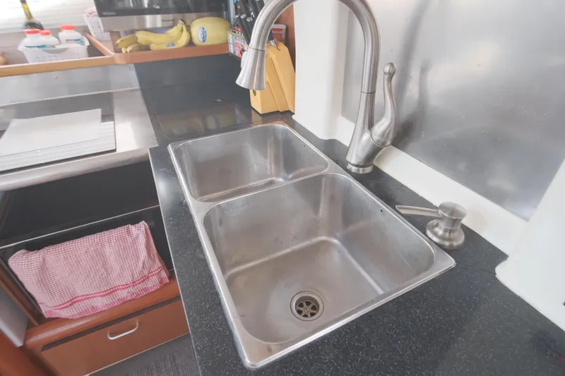 Slide: The Image of Stainless steel double sink in a 2007 Leopard 46 yacht kitchen. - 47
