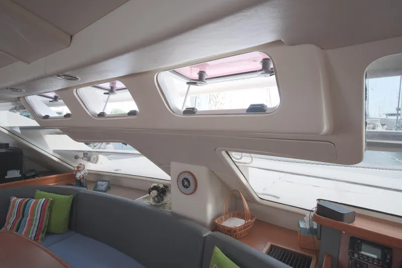 Slide: The Image of Interior of 2007 Leopard 46 yacht with panoramic windows and cozy seating area. - 49