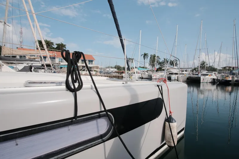 Slide: The Image of Leopard 46 catamaran docked in marina, 2007 model, with clear blue sky. - 5