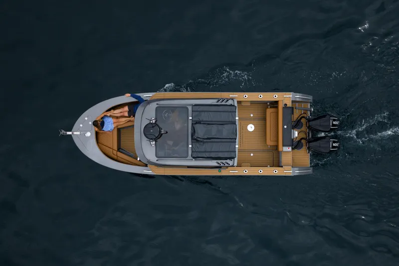 Slide: The Image of Overhead view of 2026 Jasper Marine Defender 22 boat cruising on water. - 4