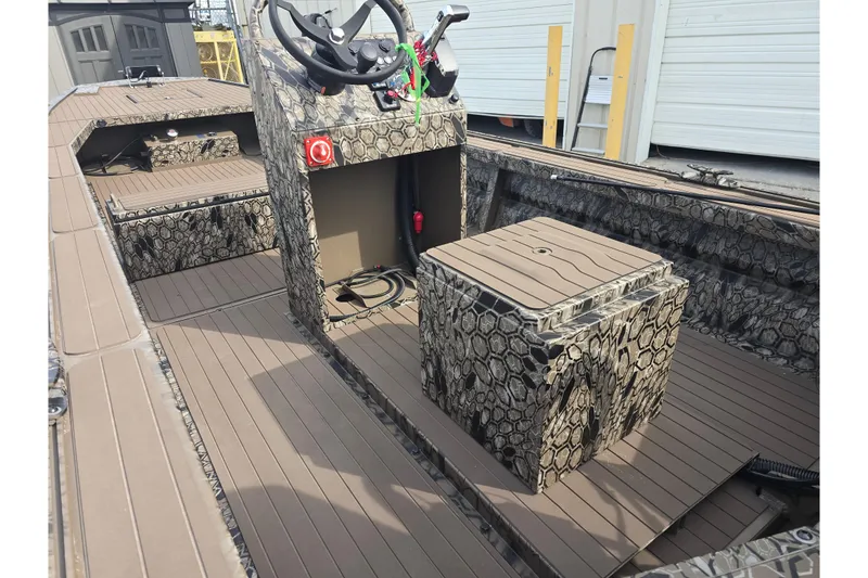 Slide: The Image of 2026 Pro-Drive 2060 boat interior with camouflage design and steering console. - 10