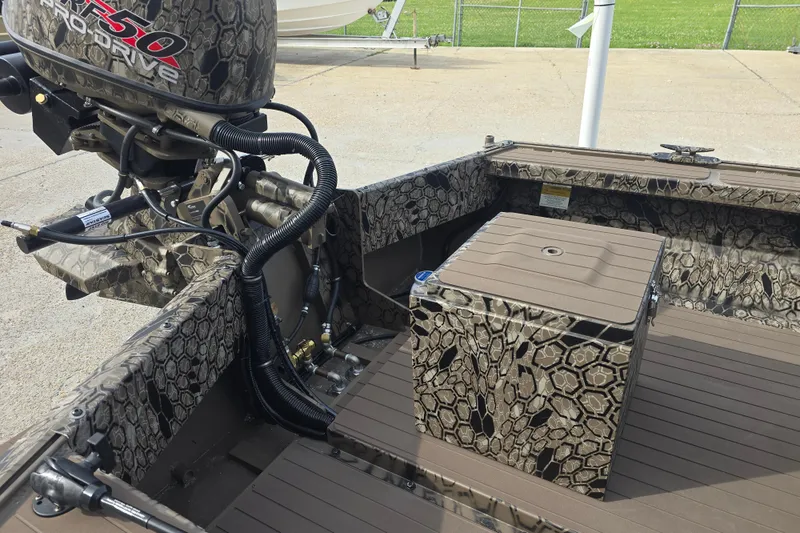 Slide: The Image of Camouflage-patterned Pro-Drive 2060 boat interior with motor, 2026 model. - 11