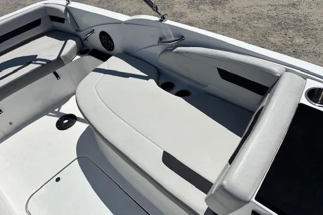 Slide: The Image of 2023 Hurricane SunDeck Sport 185 OB boat interior with white seating and cup holders. - 13