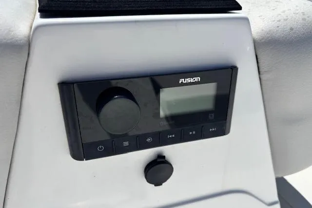 Slide: The Image of Fusion audio system on 2023 Hurricane SunDeck Sport 185 OB boat dashboard. - 19