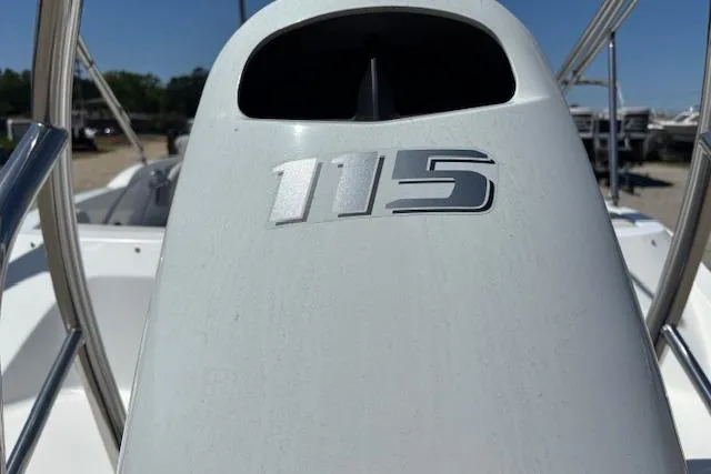 Slide: The Image of 2023 Hurricane SunDeck Sport 185 OB boat engine with "115" horsepower marking. - 22
