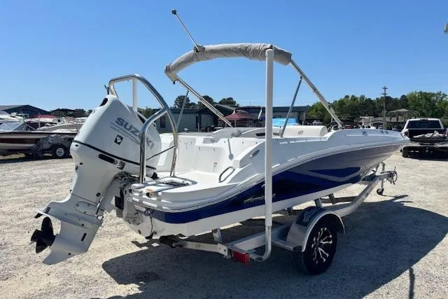 Slide: The Image of 2023 Hurricane SunDeck Sport 185 OB boat with Suzuki outboard motor on trailer. - 5