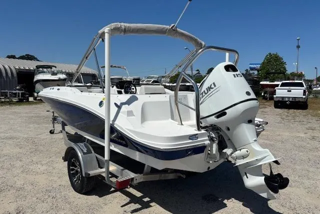 Slide: The Image of 2023 Hurricane SunDeck Sport 185 OB boat with Suzuki outboard motor on trailer. - 7
