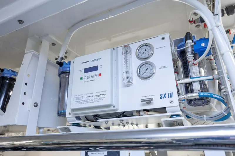 Slide: The Image of Water filtration system on 2017 Hatteras M75 Panacera yacht, featuring gauges and control panel. - 100