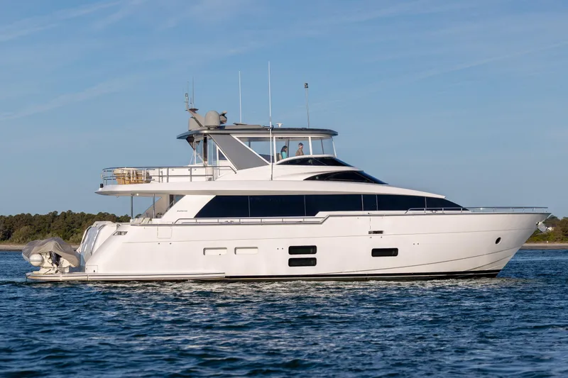 Slide: The Image of Luxury 2017 Hatteras M75 Panacera yacht cruising on open water. - 11