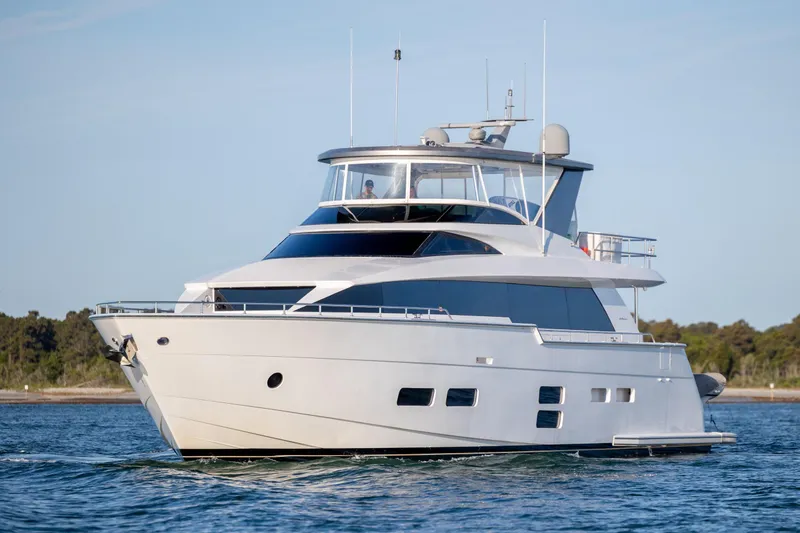 Slide: The Image of Luxurious 2017 Hatteras M75 Panacera yacht cruising on calm waters. - 13