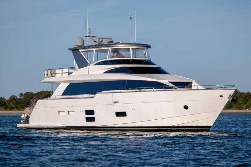 Slide: The Image of 2017 Hatteras M75 Panacera yacht cruising on calm waters. - 15