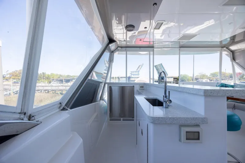 Slide: The Image of Luxurious interior of 2017 Hatteras M75 Panacera yacht with modern kitchen amenities. - 19