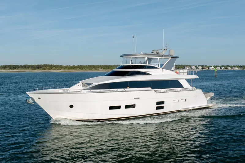 Slide: The Image of Luxurious 2017 Hatteras M75 Panacera yacht cruising on serene waters. - 2