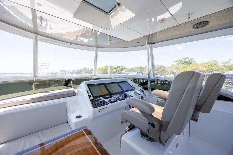Slide: The Image of Luxurious helm of 2017 Hatteras M75 Panacera yacht with modern navigation displays. - 20