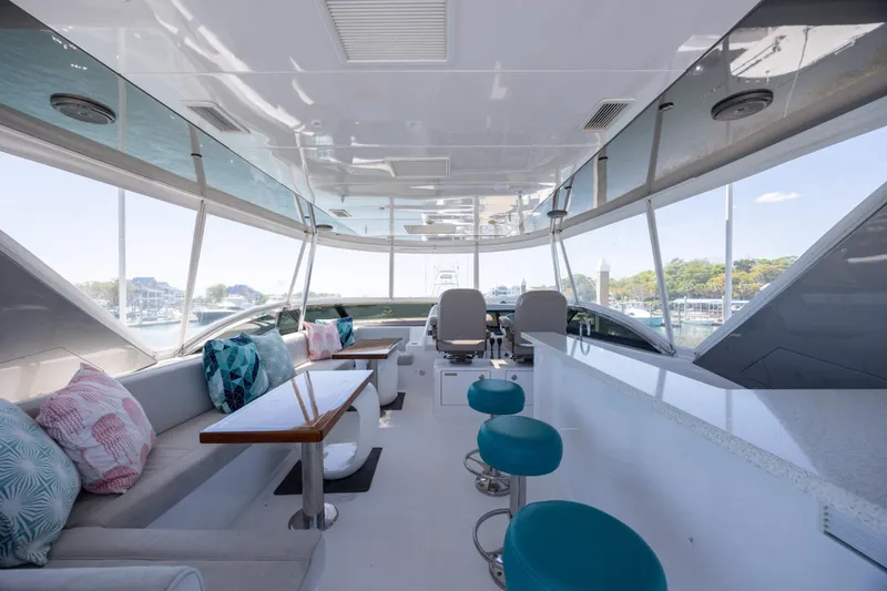 Slide: The Image of Luxurious interior of 2017 Hatteras M75 Panacera yacht with seating and bar area. - 21