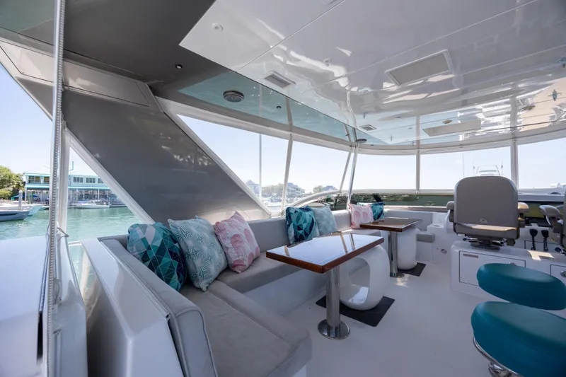 Slide: The Image of Luxurious interior of 2017 Hatteras M75 Panacera yacht with plush seating and scenic views. - 22