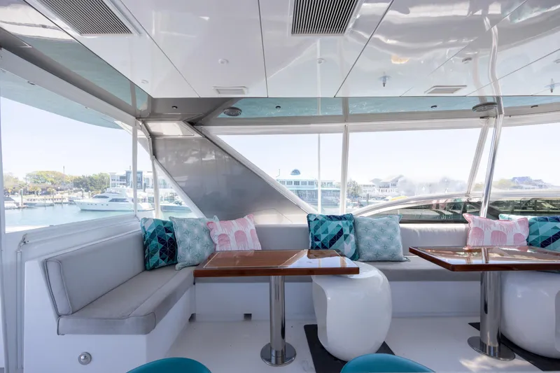 Slide: The Image of Luxurious interior of 2017 Hatteras M75 Panacera yacht with modern seating and decorative pillows. - 23