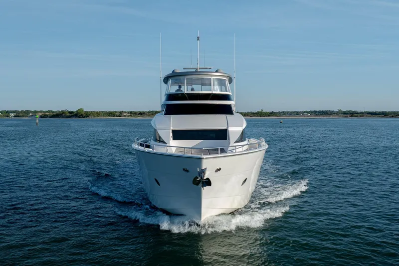 Slide: The Image of Front view of a 2017 Hatteras M75 Panacera yacht cruising on open water. - 3