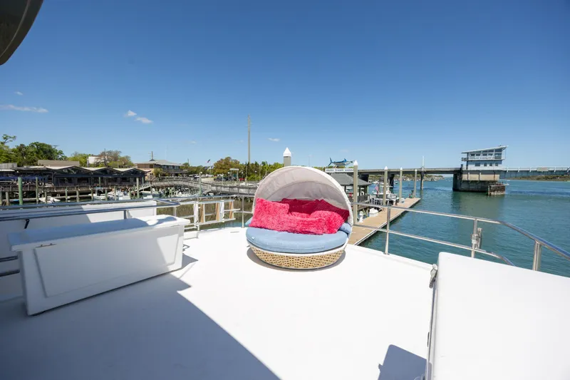 Slide: The Image of Luxurious deck of 2017 Hatteras M75 Panacera yacht with cozy seating and waterfront view. - 33