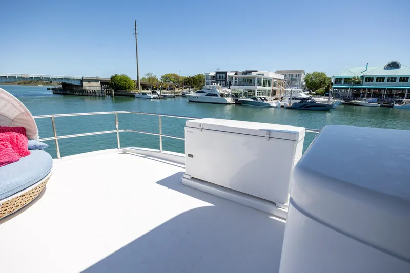 Slide: The Image of Deck view of 2017 Hatteras M75 Panacera yacht in a marina setting. - 35