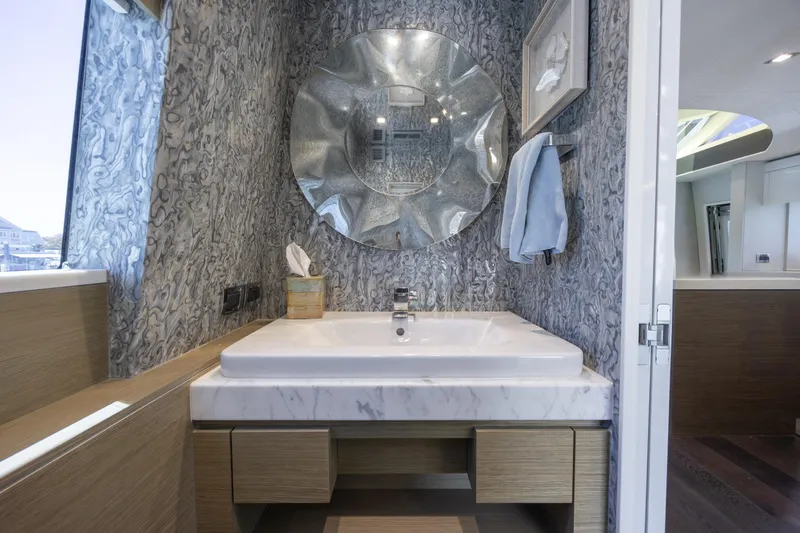 Slide: The Image of Luxurious bathroom on 2017 Hatteras M75 Panacera yacht with elegant marble sink and modern decor. - 38