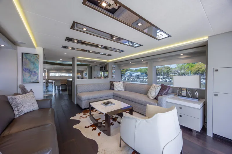 Slide: The Image of Luxurious interior of 2017 Hatteras M75 Panacera yacht with modern furnishings and large windows. - 39