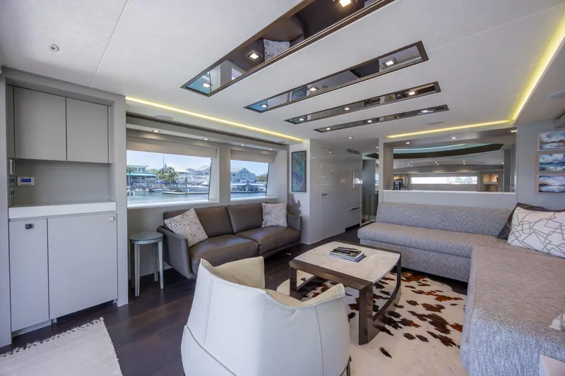 Slide: The Image of Luxurious interior of 2017 Hatteras M75 Panacera yacht with modern furnishings and large windows. - 40