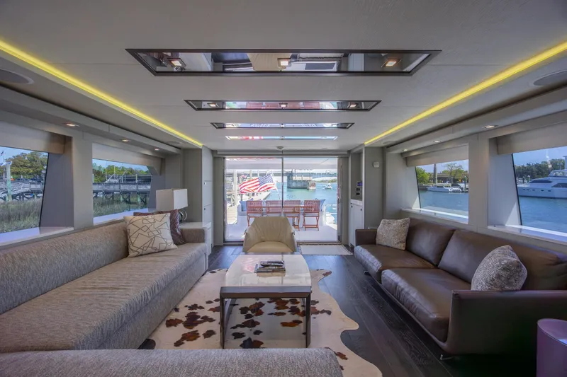 Slide: The Image of Luxurious interior of 2017 Hatteras M75 Panacera yacht with elegant seating and scenic views. - 41