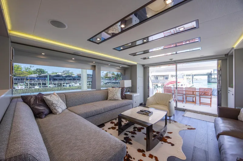 Slide: The Image of Luxurious interior of 2017 Hatteras M75 Panacera yacht with modern furnishings and large windows. - 42