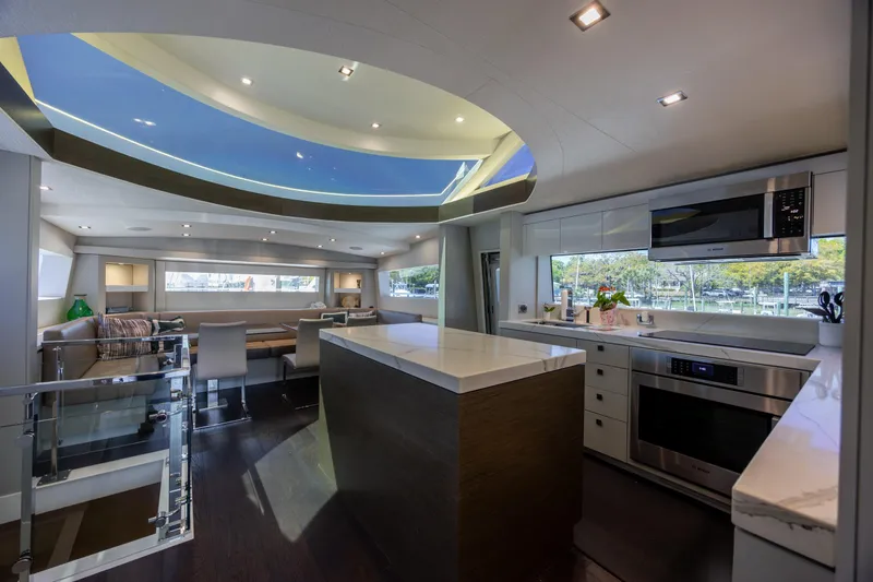 Slide: The Image of Luxurious interior of 2017 Hatteras M75 Panacera yacht with modern kitchen and seating area. - 45
