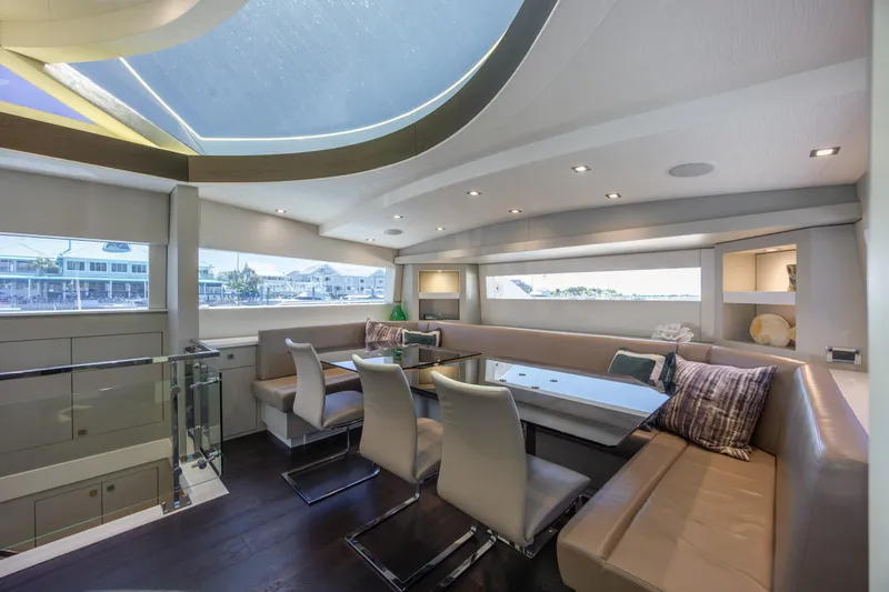 Slide: The Image of Luxurious interior of 2017 Hatteras M75 Panacera yacht with elegant seating and large windows. - 48